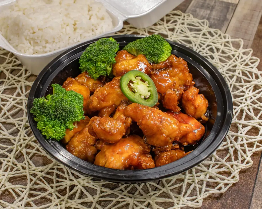 General Tso's chicken plated with broccoli and dried chilies