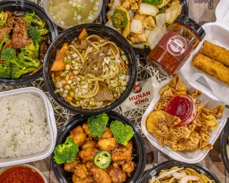 A large spread of Hunan King dishes laid out for a group