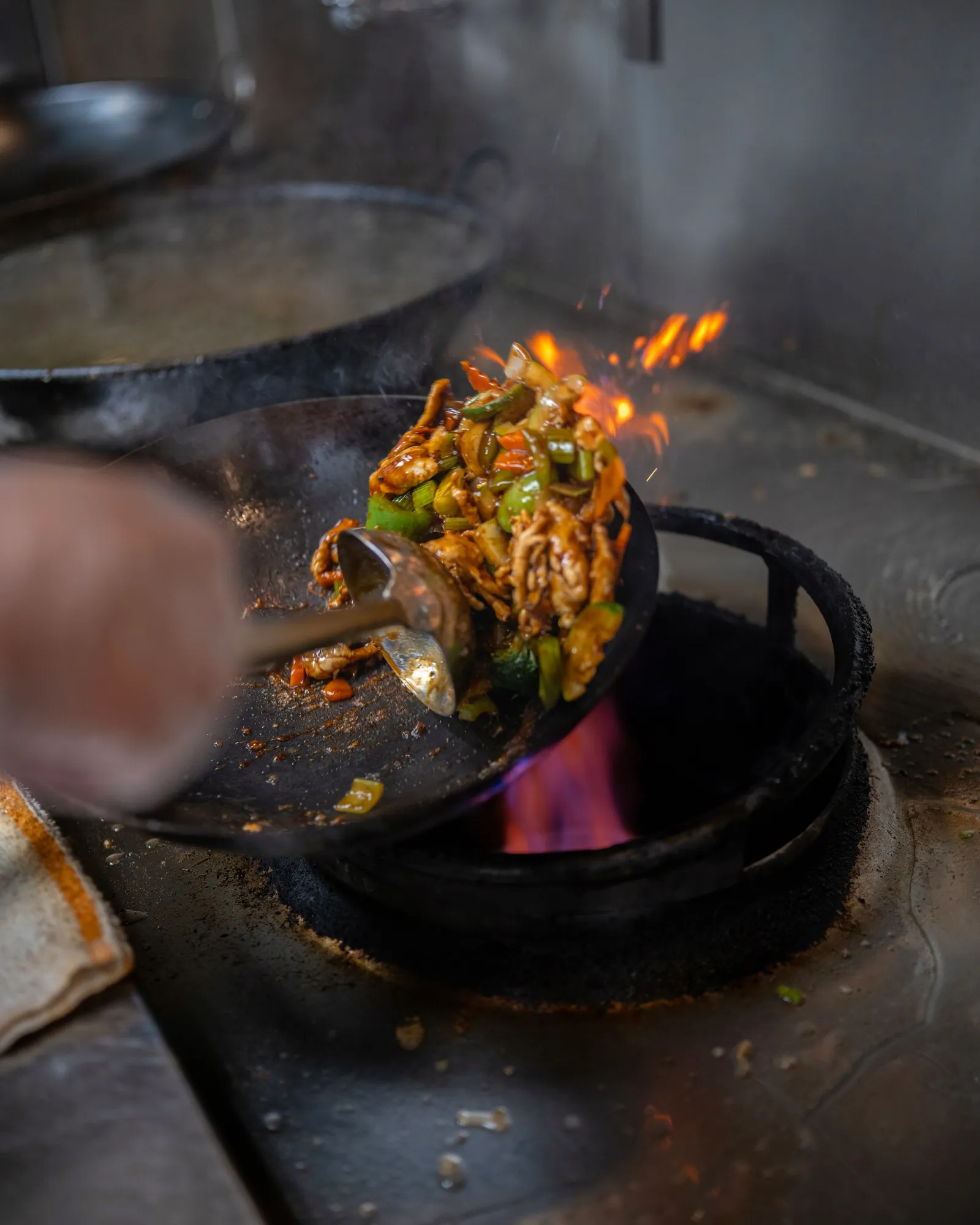 A wok firing on the line at Hunan King